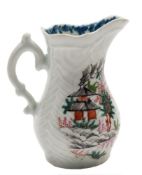 A First Period Worcester feather-moulded cream jug: with double scroll handle,