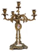 A 19th century porcelain and ormolu four-light candelabrum: of foliate rococo form in the Louis XV