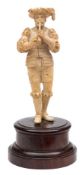 A 19th century carved Dieppe ivory figure of an Elizabethan minstrel: wearing a broad hat with