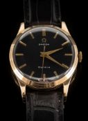 Omega - A gentleman's 'Omega' 9ct gold cased, manual wristwatch: the black dial with baton markers,