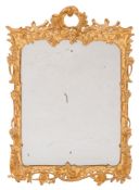 A late 19th Century carved giltwood cartouche-shaped wall mirror:,