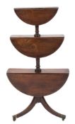 A Regency mahogany circular three-tier graduated drop flap dumb waiter,
