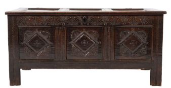 An 18th Century oak rectangular coffer:, with a plain triple panelled hinged top,