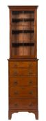 A mahogany secretaire bookcase:, of small size, the upper part with a moulded and reeded cornice,
