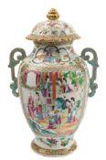 A Canton porcelain two handled vase and cover: of footed oviform with domed petal shaped cover and
