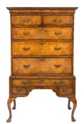 An 18th Century walnut and feather banded chest on stand:, with pine sides,