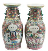 A pair of Chinese famille rose vases for the Straits market: of baluster form with Buddhist