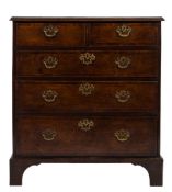 An 18th Century oak and mahogany crossbanded rectangular chest:, the top with a moulded edge,