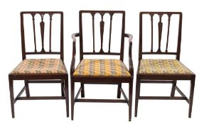 A set of twelve 19th Century mahogany dining chairs in the Hepplewhite taste:,