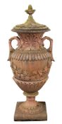 A terracotta twin-handled pedestal urn and cover:,