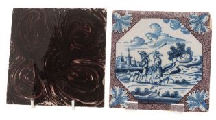 Two 18th century delftware tiles: one painted overall in marbled manganese,
