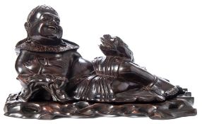 A Chinese carved hardwood figure of a reclining Lin Hai and his three-legged toad: mounted on a