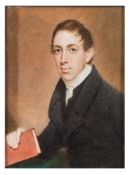 English School 19th Century- A miniature portrait of a young scholar, half-length seated,