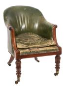 An early 19th Century carved mahogany library armchair:, of tub-shaped outline,