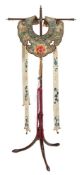 A Chinese silk embroidered collar,: the shaped green ground surround embroidered with insects,