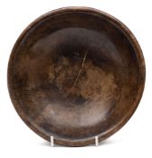 A late 18th/19th Century treen bowl: of shallow form, the exterior with turned rings,