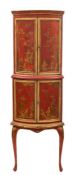 A red lacquer, cream and gilt and chinoiserie decorated bow-fronted standing corner cupboard:,