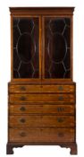 An early 19th Century mahogany and inlaid secretaire bookcase:,