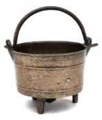 A small bronze tripod cauldron: with iron swing handle, triangular founder's mark,