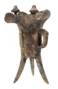 A Chinese cast iron jue: of archaic design, with dragon head handle, banded archaic motifs,