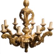 A carved giltwood eight-branch electrolier: with acanthus decorated knopped stem and eight