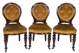 A set of six Victorian carved mahogany dining chairs:,