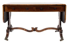 A Regency rosewood and inlaid sofa table:, bordered with sycamore lines,