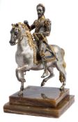 An equestrian statue of Henry IV of France (1553-1610) gilt and silvered metal model: the seated