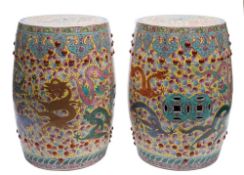 A pair of Chinese yellow-ground porcelain garden seats: each of barrel shaped form,