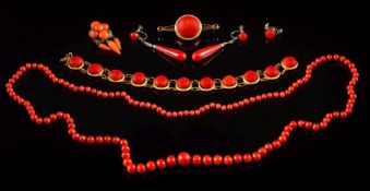 A collection of mounted coral jewellery to include: a circular-link bracelet stamped 'K12',
