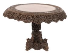 A 19th Century Burmese carved hardwood circular centre table,