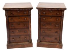 A pair of rosewood pedestal chests: each with an overhanging frieze drawer with reeded mouldings