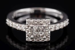 A princess-cut diamond cluster ring: with central panel of four princess-cut diamonds,