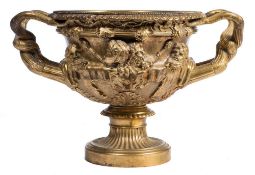 A 19th century gilt bronze copy of the Warwick vase: the body cast in relief with bacchanalian