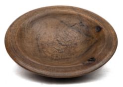 An 18th Century treen bowl: the rim and exterior with reeded bands, the base inscribed 'MLD/1792',