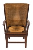 An oak and seagrass Orkney Islands child's wing armchair:, with a curved seagrass rope pattern back,