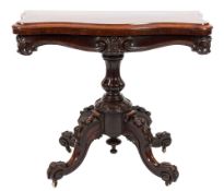 A Victorian carved rosewood card table:, of serpentine outline with a baize lined hinged top,