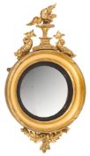 A Regency carved giltwood circular convex mirror:,