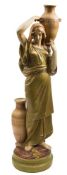 An Amphora porcelain female water carrier: modelled standing barefoot supporting an urn on her