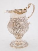 A George III pedestal cream jug, maker Charles Hougham, London, 1779: of helmet type,