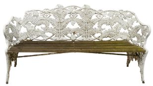 A cast iron and later white painted fern pattern garden seat of Coalbrookdale type,