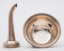 A George III silver wine funnel, maker's mark worn, London, 1787: crested,