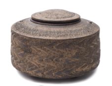 Jason Wason a stoneware 'Zig Zag' lidded jar: of circular form on four tapering peg feet,