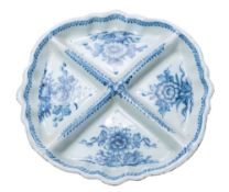 An English blue and white delftware four-division tripod sweetmeat dish: painted with tree peonies