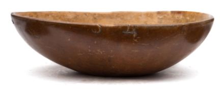 A treen 'coco de mer' shaped bowl: probably 19th century, 35 x 24 cm.
