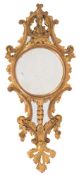 A carved giltwood mirror:, of cartouche-shaped outline with palmette,