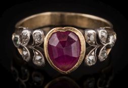 A heart-shaped ruby and diamond ring: the central heart-shaped ruby approximately 8mm long x 6mm at