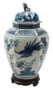 A Japanese Arita blue and white hexagonal jar and cover: with shi-shi finial,
