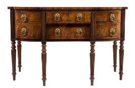 A Regency mahogany and inlaid sideboard:, of bowed and breakfront outline,