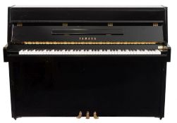 A Yamaha Disklavier MX80 upright piano:, in an ebony case,